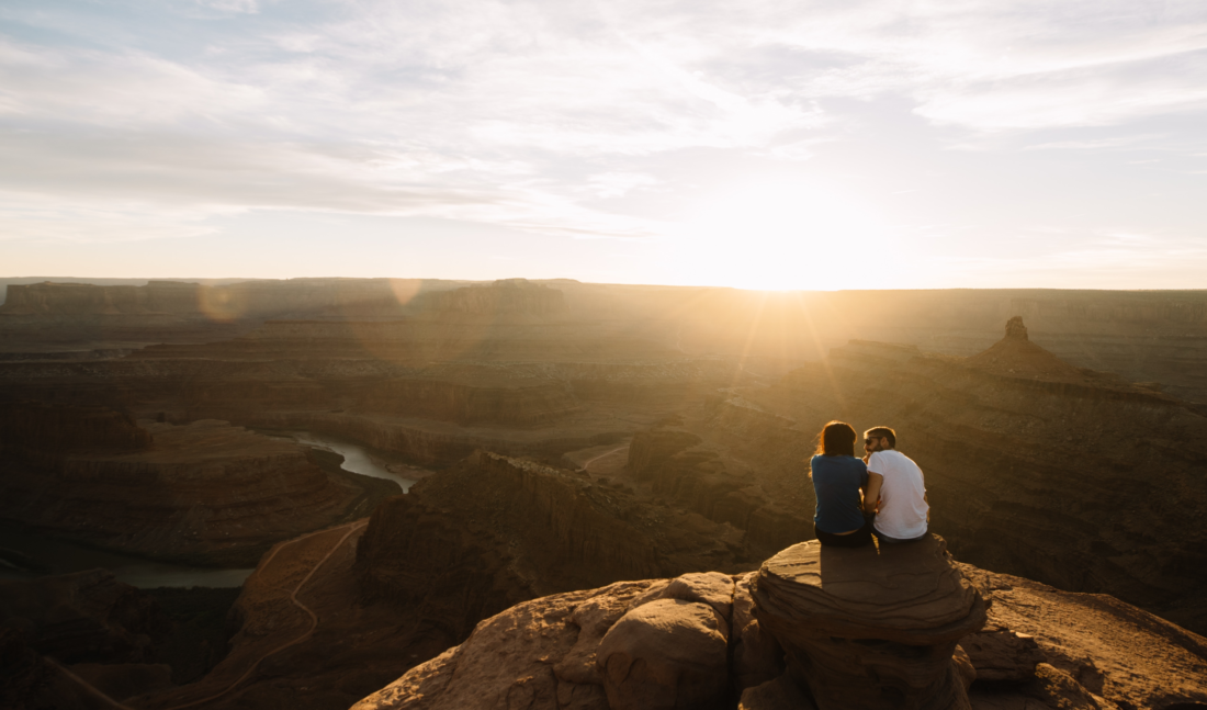 Couple looking down at canyon